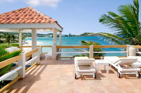 Unwind on your covered terrace with panoramic ocean vistas — the perfect spot for morning coffee or sunset cocktails.