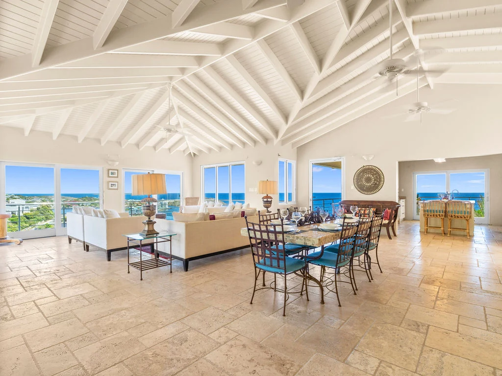 Open living and dining room with ocean views