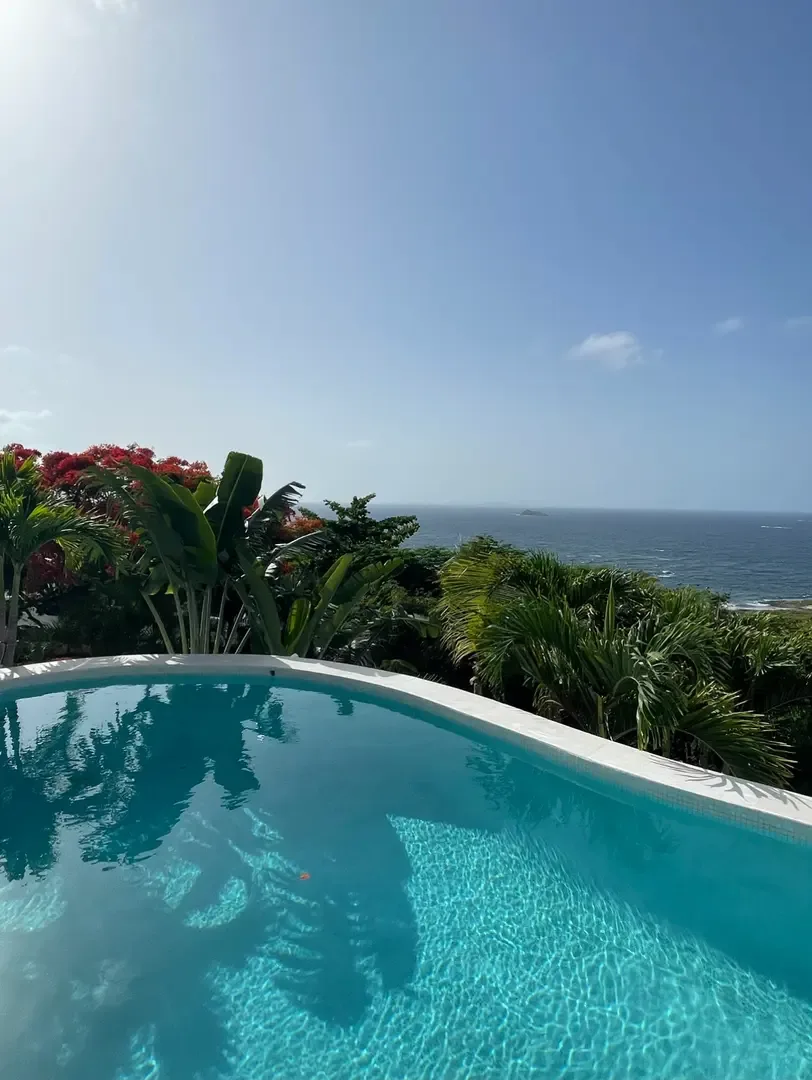 The Caribbean stretches endlessly before you — this is island living at its finest.                                                                                                                                                                                                                                                                                                                                                                                                                                  +
 