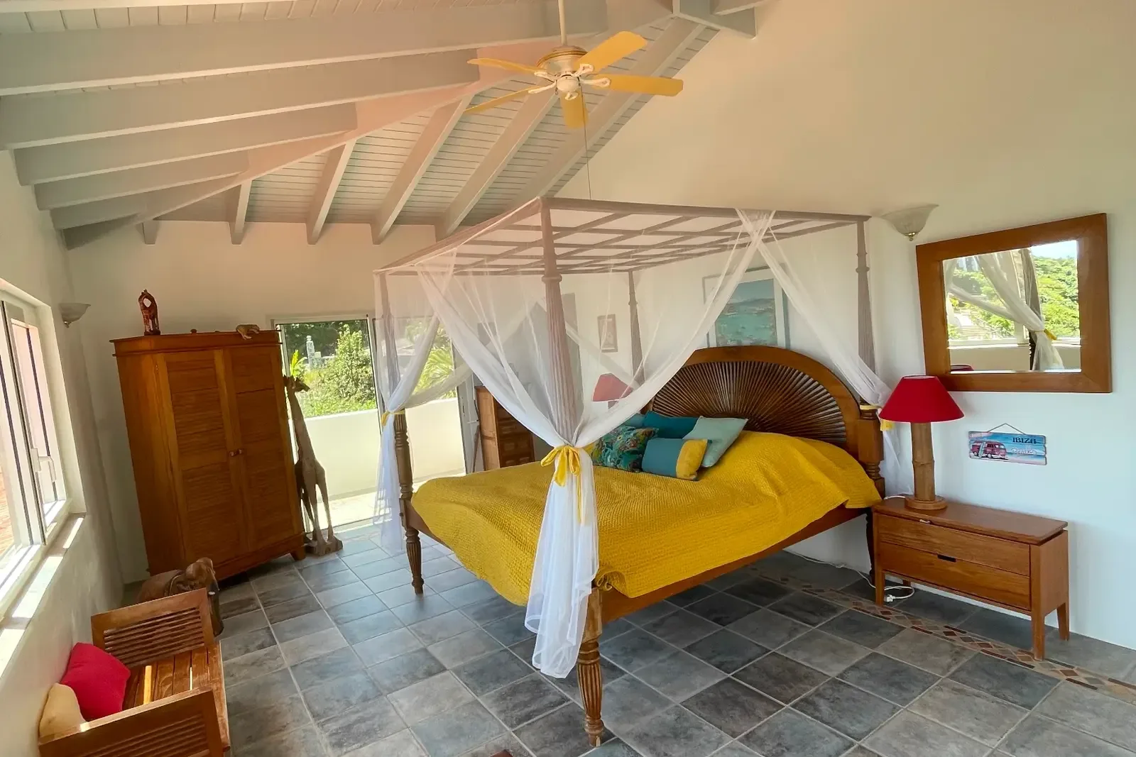 A sunny yellow canopy with teal accents — bright and cheerful island mornings.