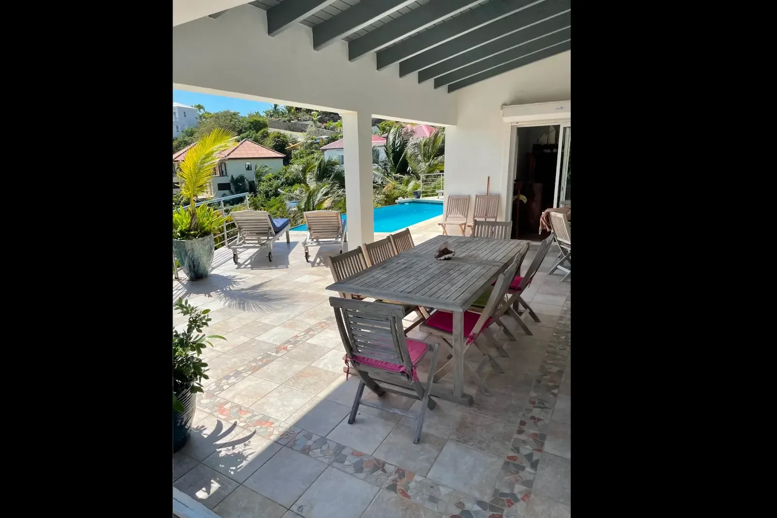 Outdoor dining for eight beside the pool — entertain under the Caribbean sky.