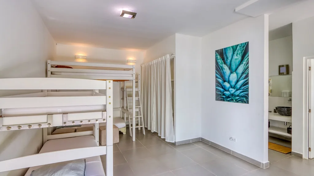Bunk bedroom with two bunk beds and ensuite entry