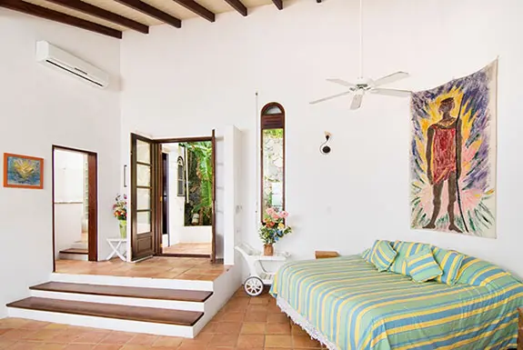 A cozy retreat with vibrant local art — perfect for guests or quiet afternoon naps.