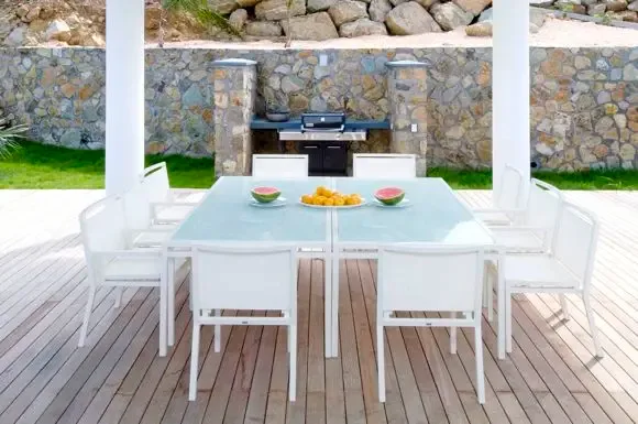 Entertain ten guests at the glass-top dining table on the spacious wooden deck, complete with built-in outdoor grill and panoramic harbor views.                                                                                                                                                                                                                                                                                                                                                                         +
 