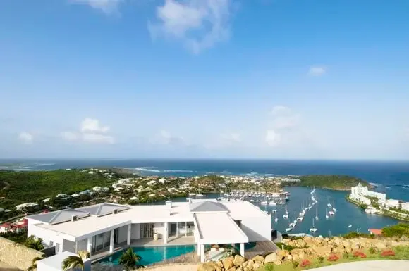 Your private infinity pool overlooks the sparkling Oyster Pond Marina, where sailboats dot the turquoise waters and the Caribbean horizon stretches endlessly before you.                                                                                                                                                                                                                                                                                                                                                   +
 