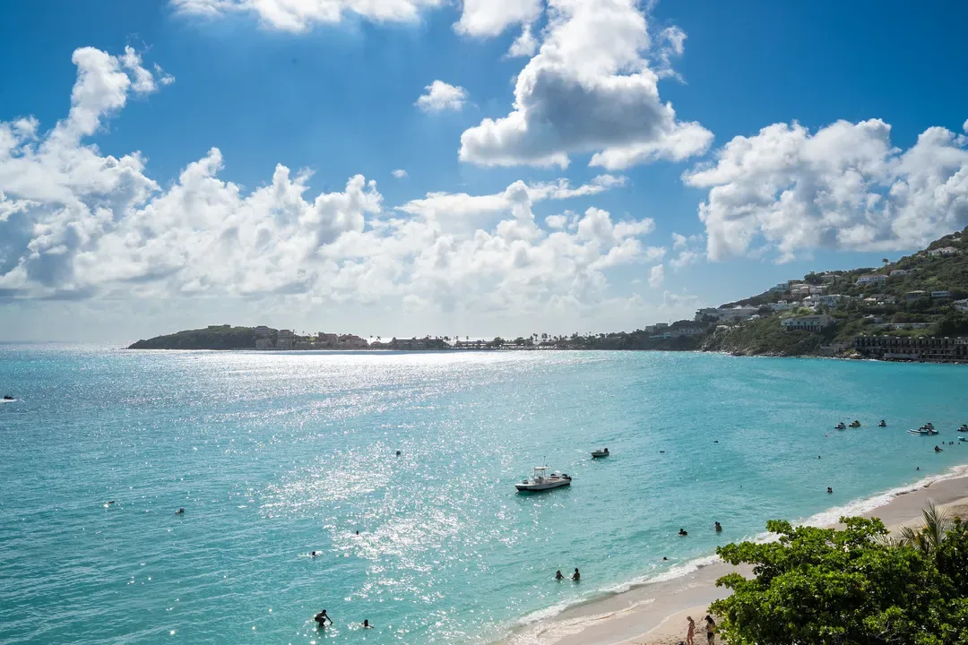 Sun-drenched waters and distant sailboats — a postcard-perfect moment on St.