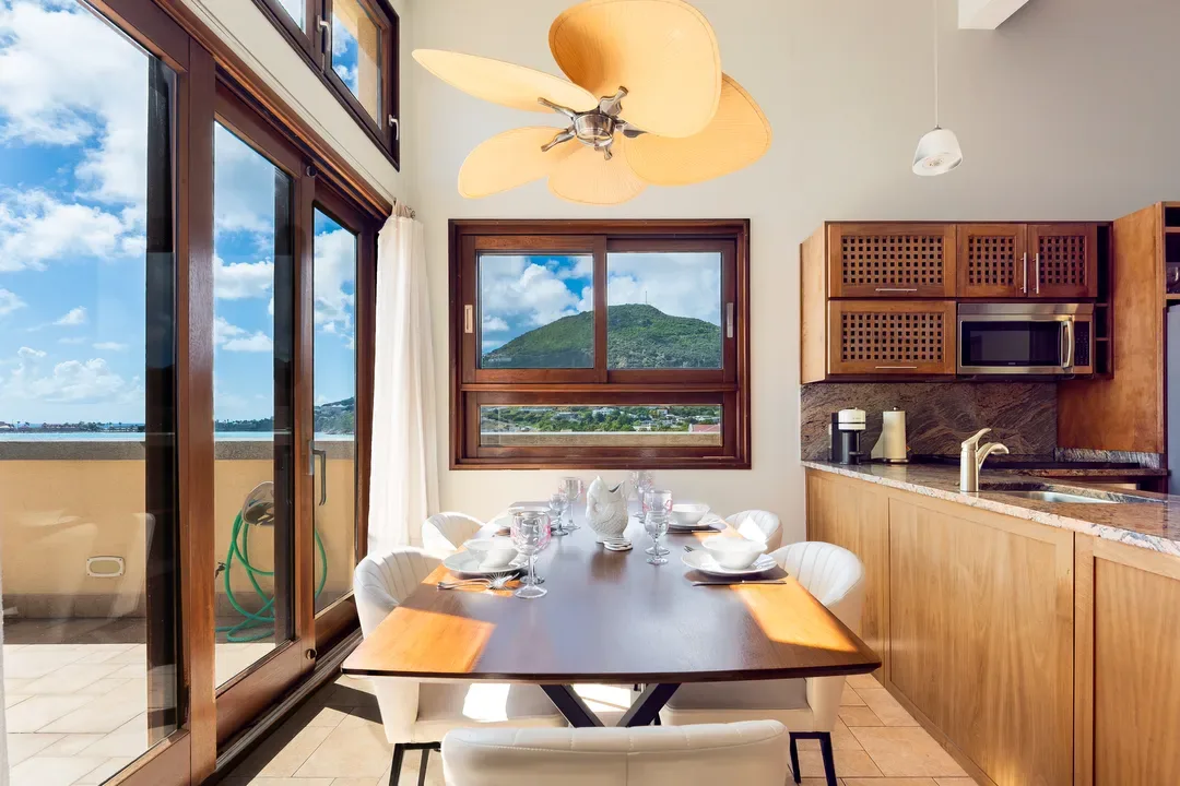 The heart of the villa — an open-concept dining and kitchen space where gourmet meals meet Caribbean ocean views.