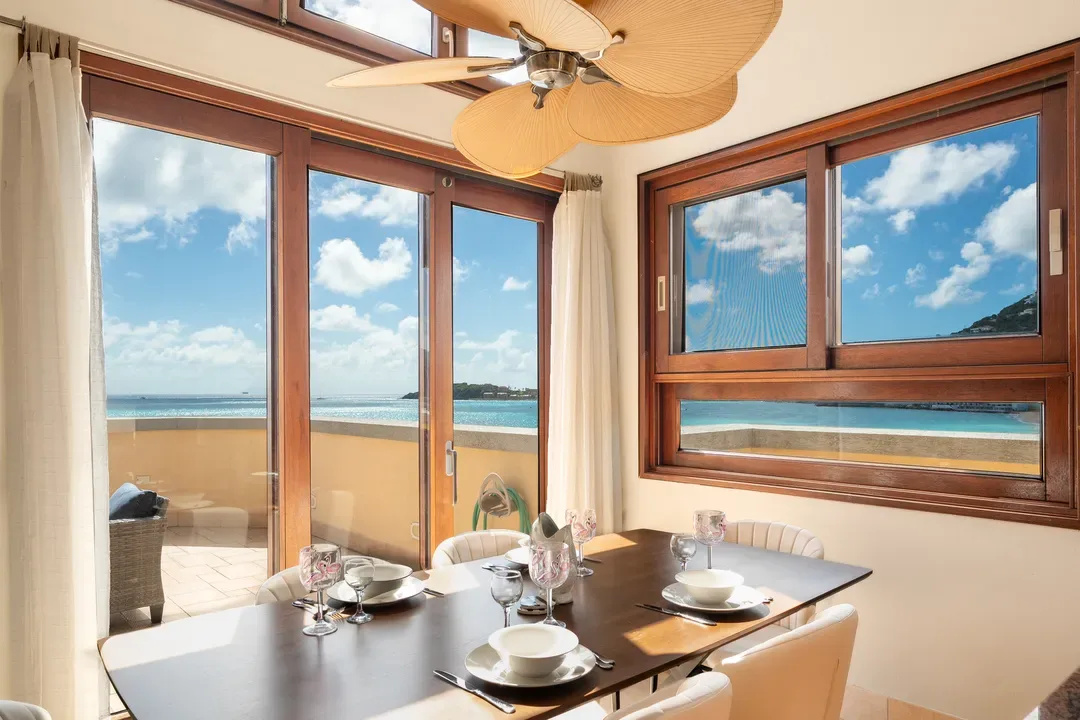 Dine al fresco or indoors with elegance — a formal dining room that opens directly to your ocean-view balcony.