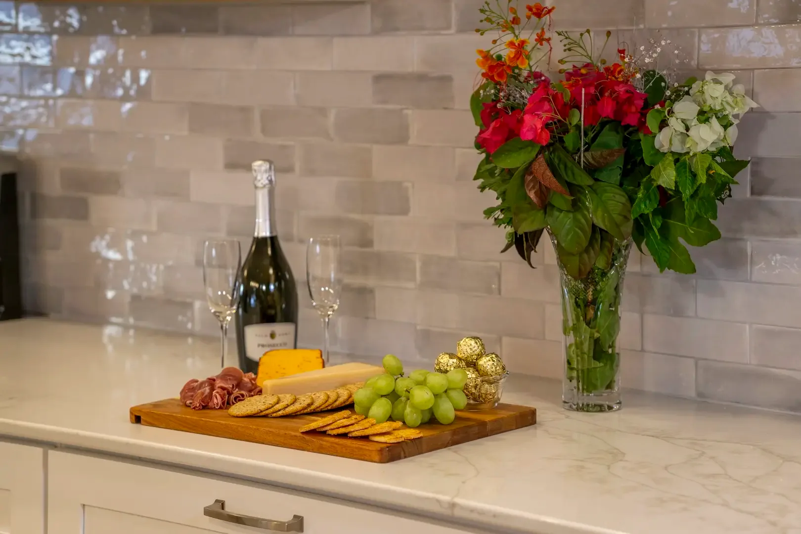 An invitation to slow down — fresh flowers, fine wine, and island-made cheeses await.