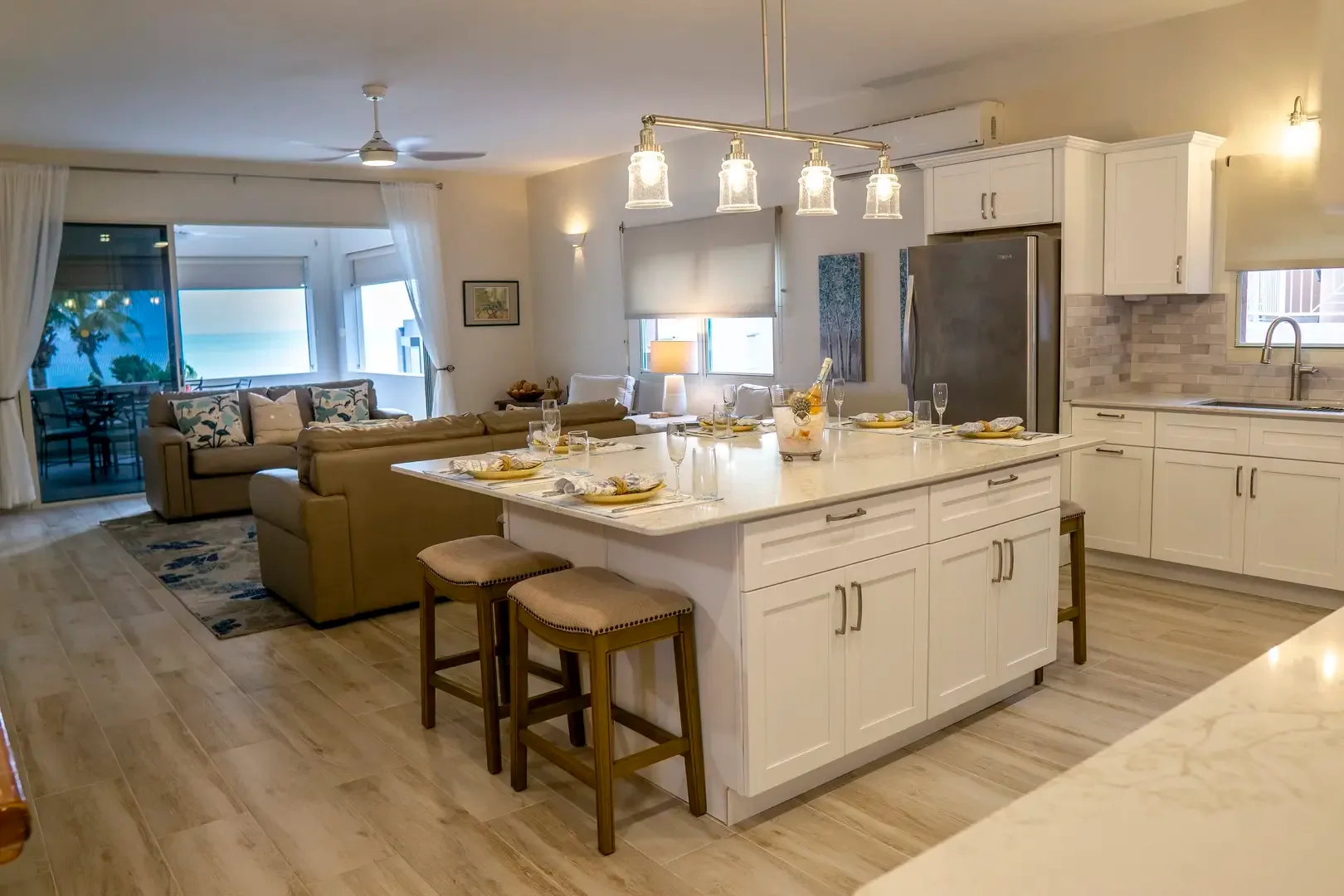 The ocean is your backdrop — sliding doors dissolve the line between indoors and paradise.
