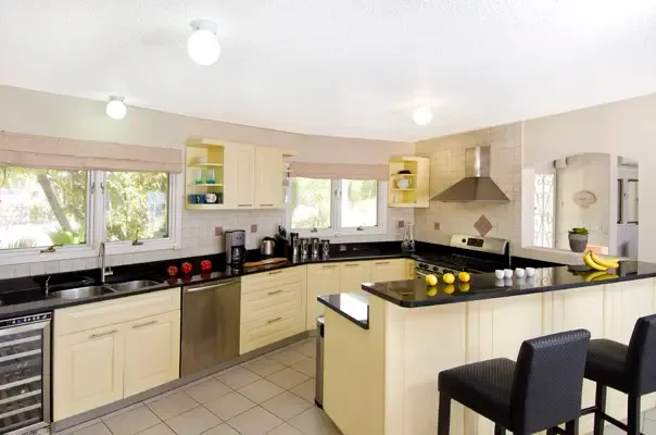 Spacious kitchen with breakfast bar, natural light, and an easy flow for relaxed island mornings.