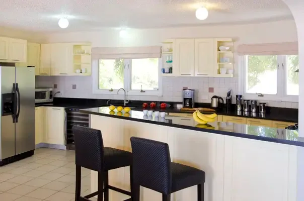 Modern kitchen designed for easy entertaining with generous counter space and bright finishes.