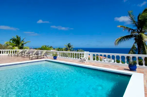Private pool terrace with panoramic ocean views and classic Caribbean outdoor living.