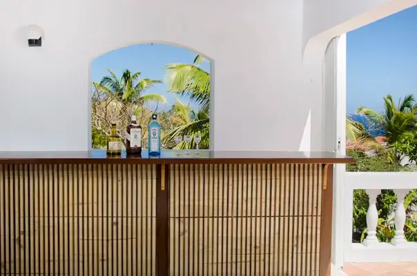 Tropical bar area designed for relaxed entertaining and easy poolside drinks.