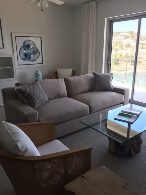 This bright living area opens directly to the ocean view — indoor-outdoor island living designed for relaxation and connection.