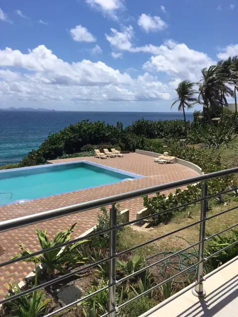 Lounge in style by the pool with panoramic ocean views — the perfect spot for sunbathing, reading, or simply doing nothing at all.