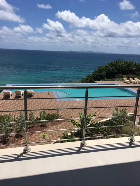 Your private pool deck overlooks the endless Caribbean — start your mornings with a swim and end your days watching the sunset over the ocean.