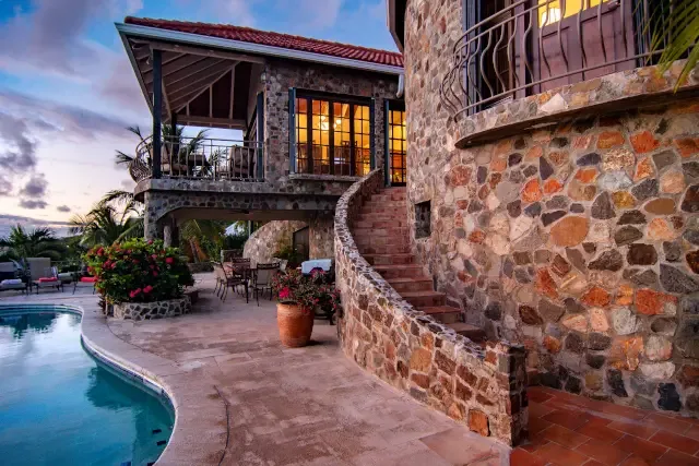 As evening falls, The Stone House glows with warmth — your elegant retreat comes alive under the stars.