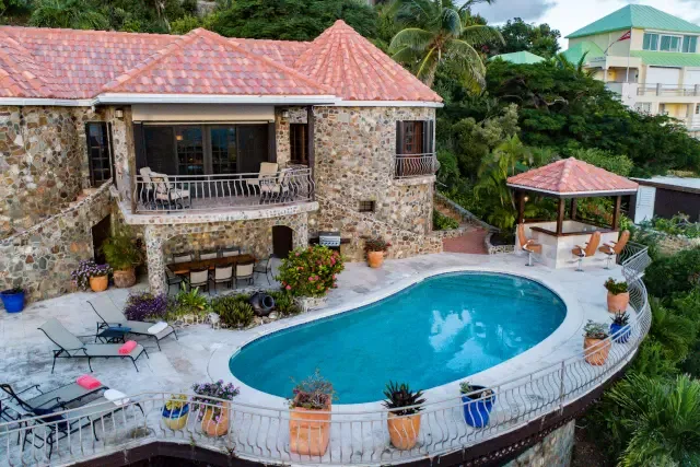Chill under the gazebo after a refreshing dip — your private oasis awaits in lush tropical gardens.