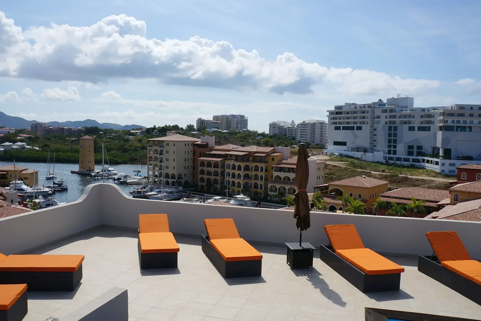Rooftop terrace with orange lounge chairs