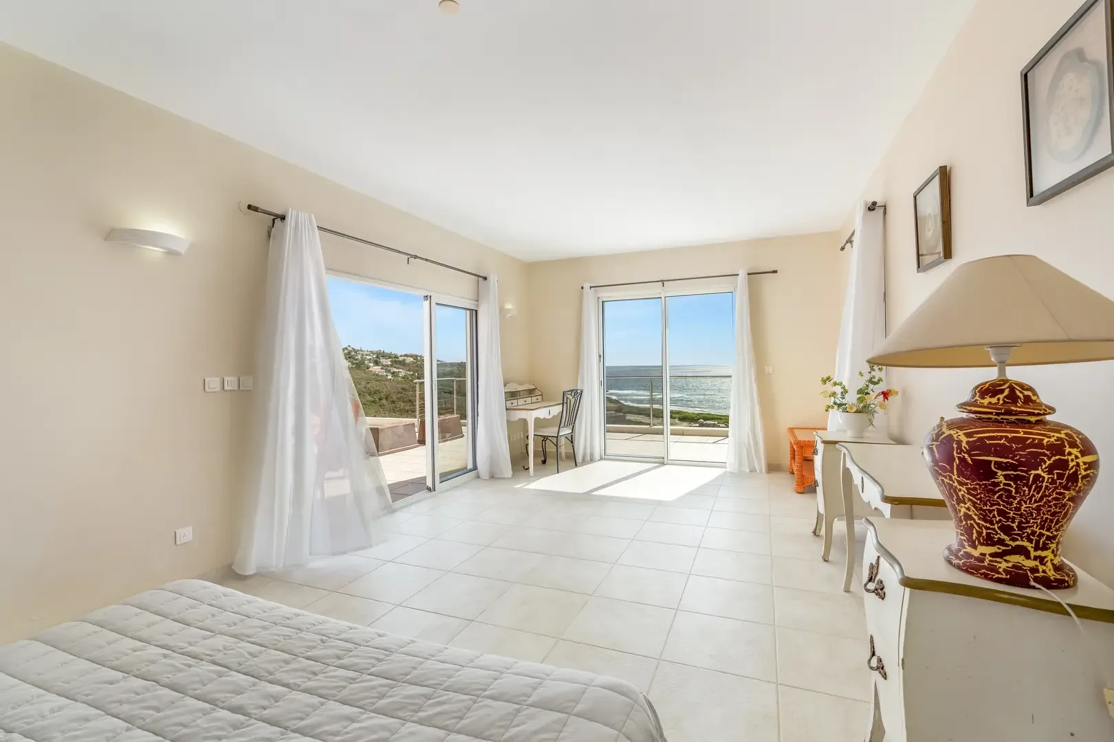Light-filled bedroom suite — a private retreat with hillside views.