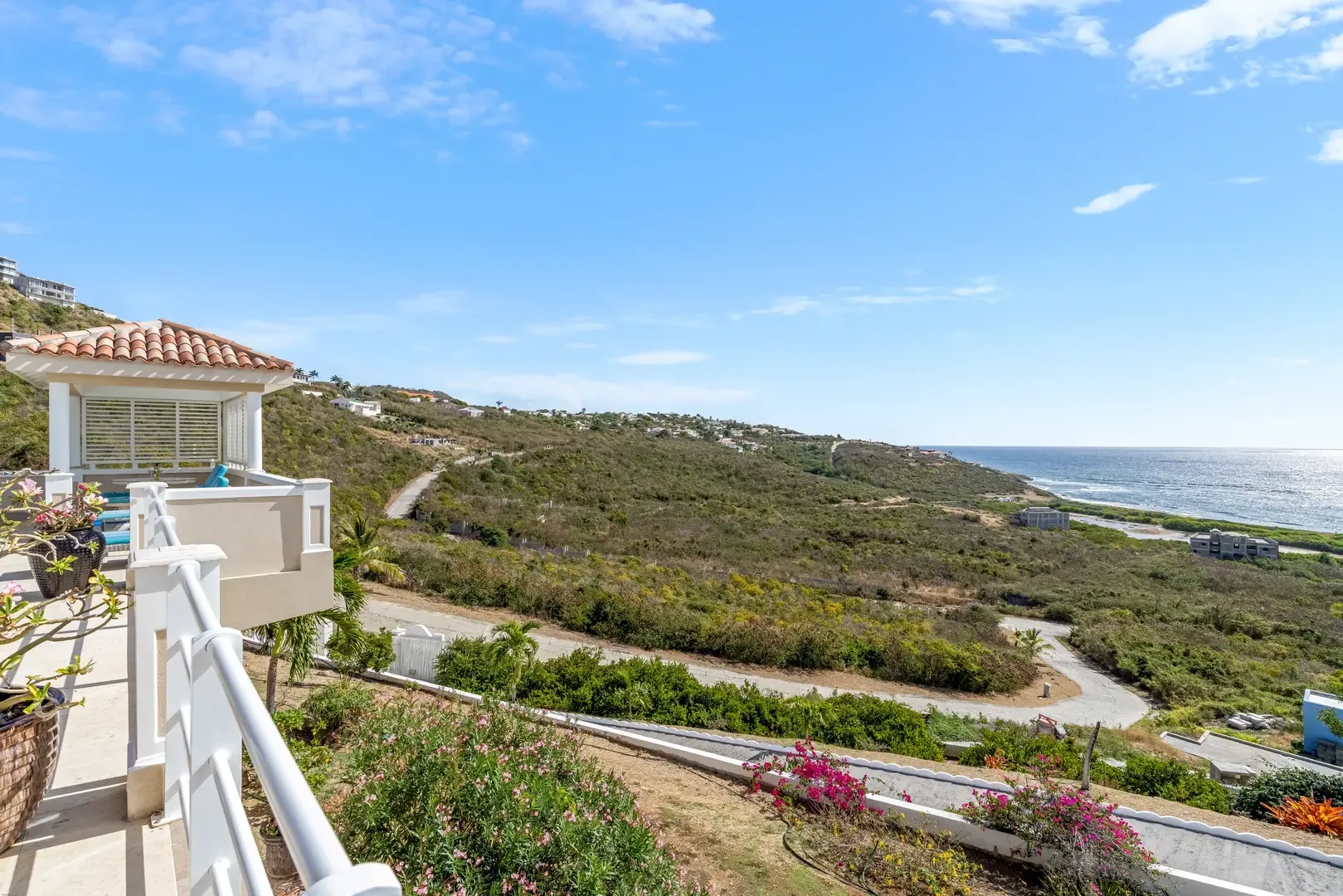Shaded terrace living — cool off while enjoying the Caribbean breeze.