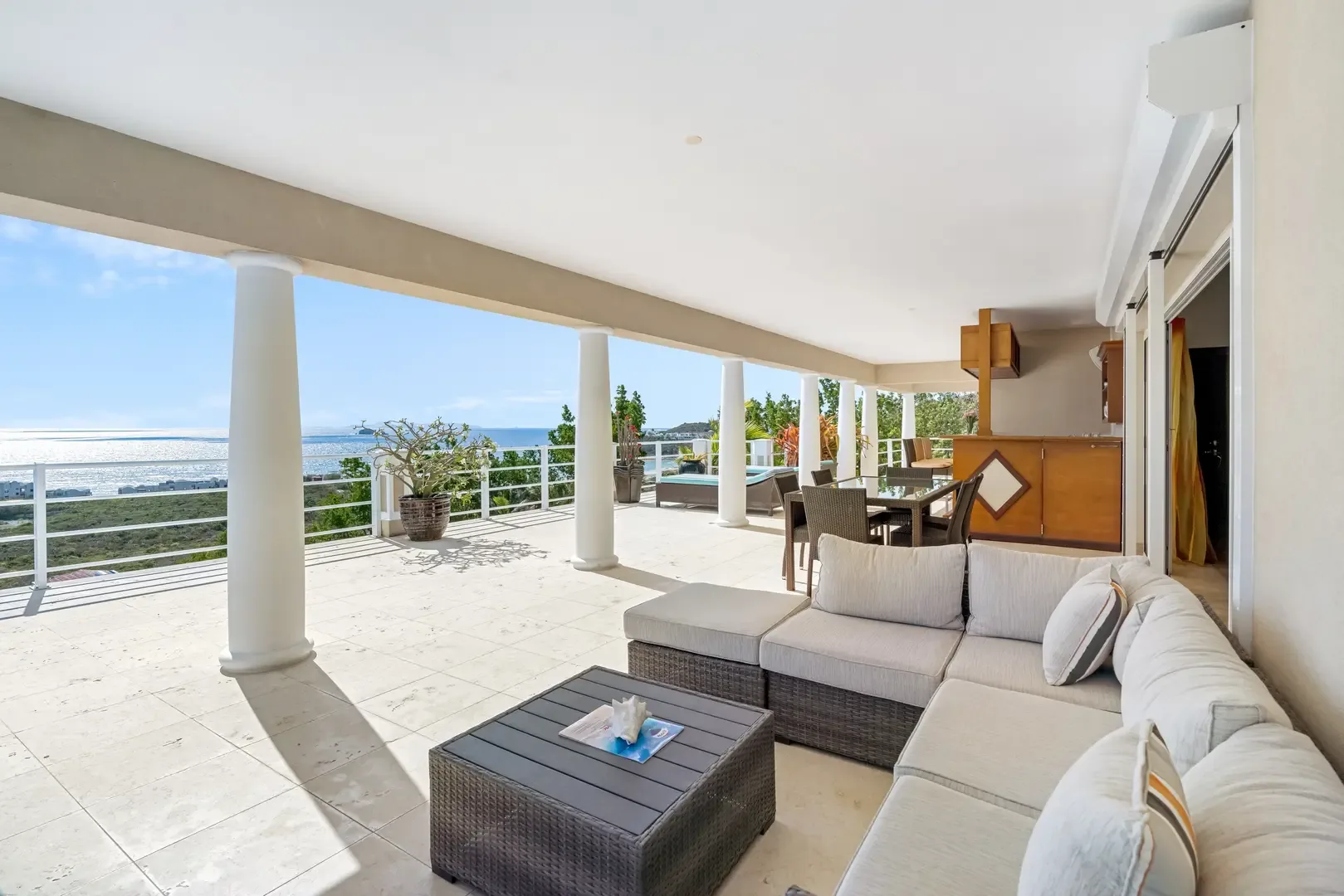 Covered terrace with comfortable seating — your outdoor living room.