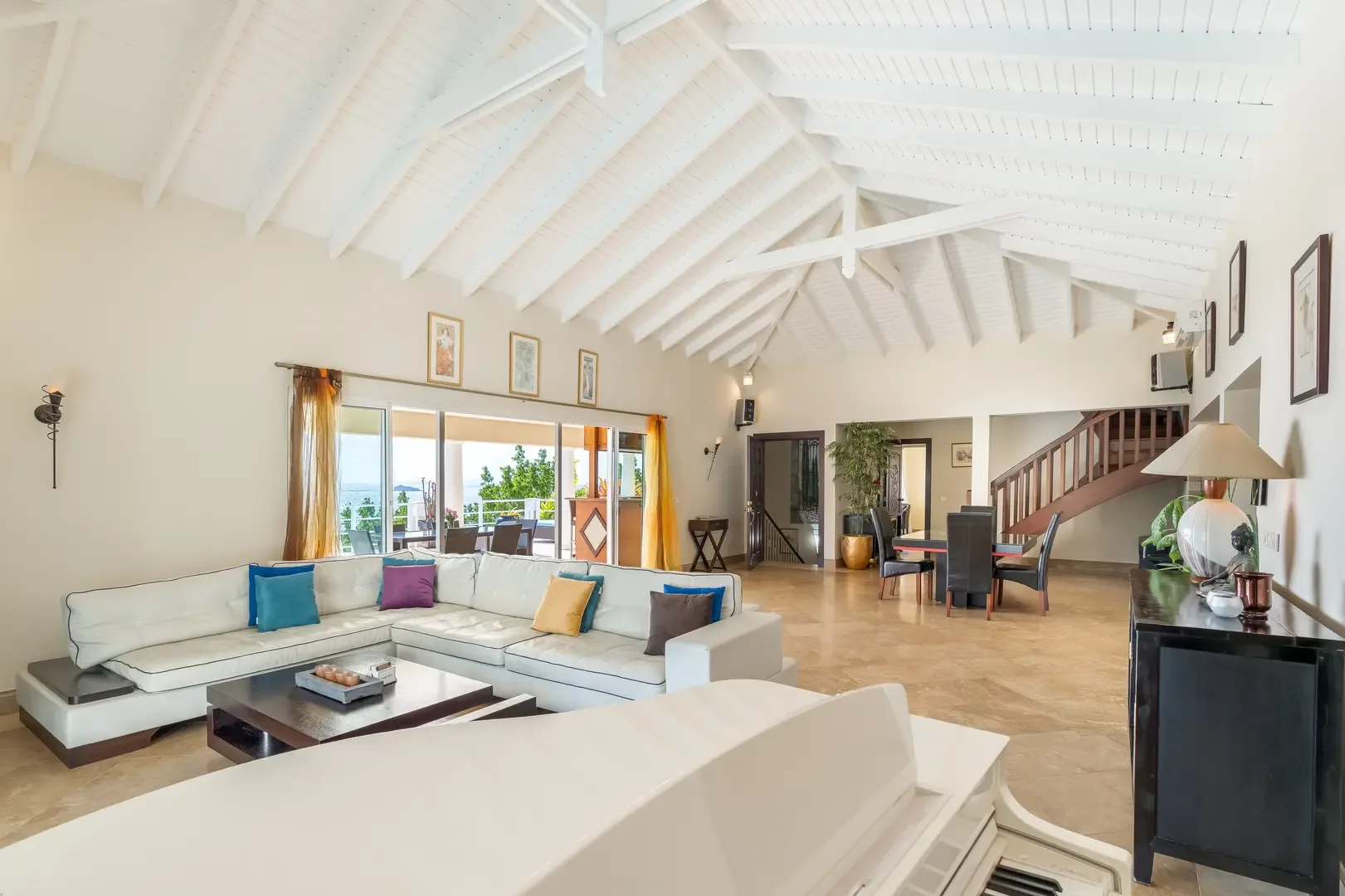 Entertain around the grand piano — your living space flows to the terrace.