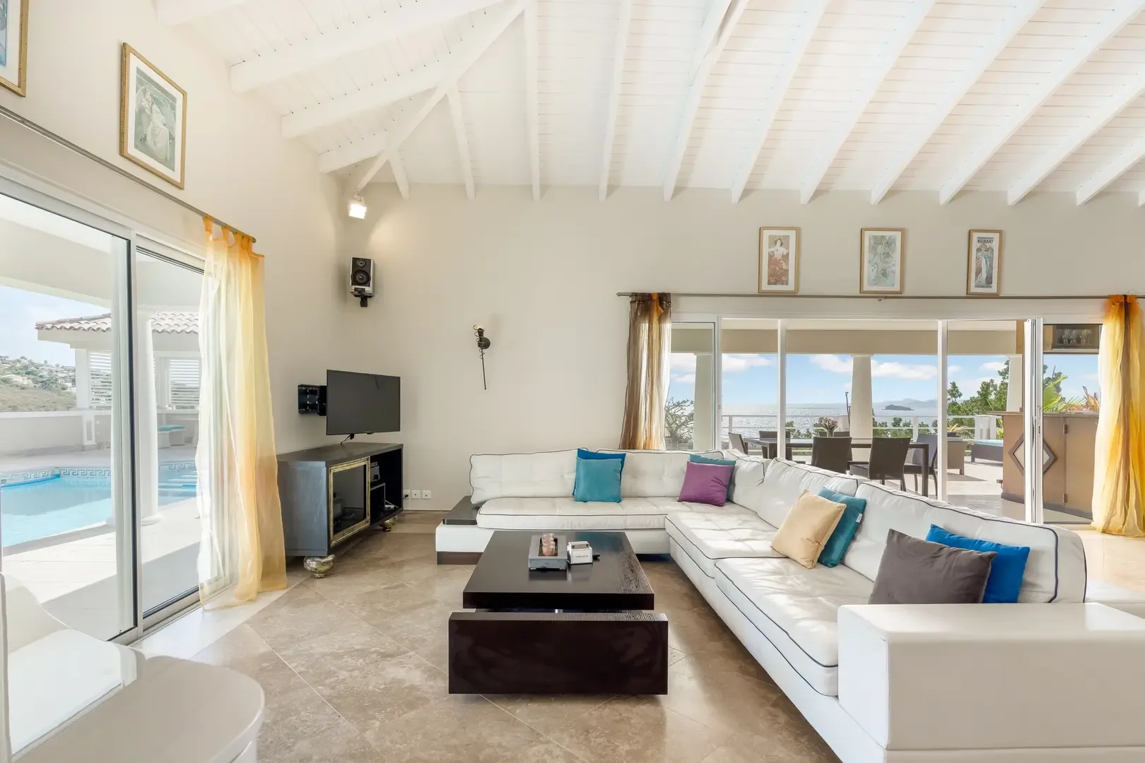 Floor-to-ceiling glass frames your pool and ocean view — paradise awaits.