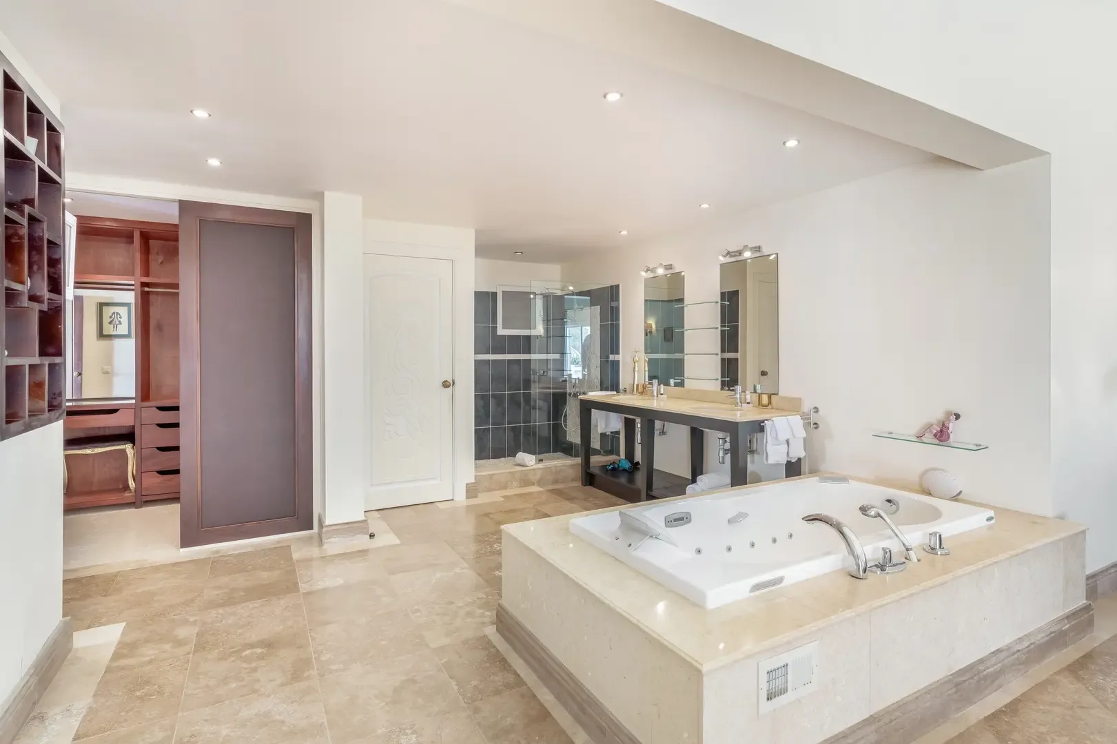 Start your morning ritual — double vanities and a spacious walk-in shower.
