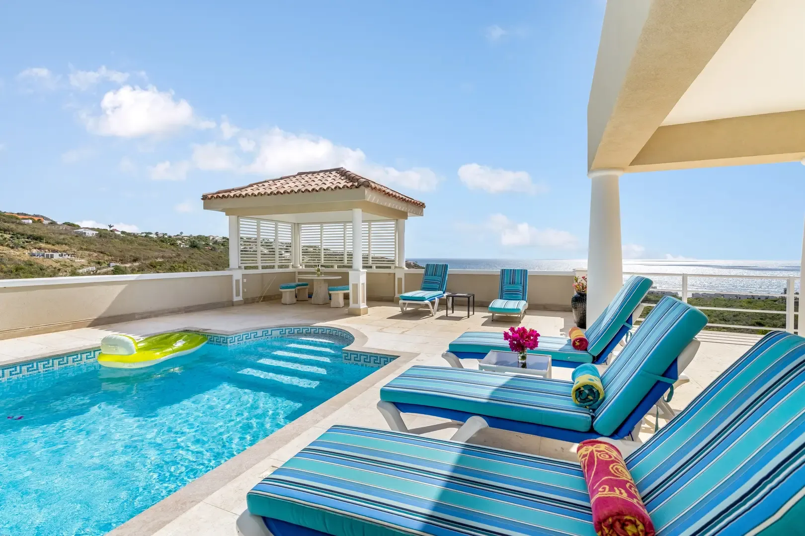 Your pool terrace with shaded pavilion — perfect for afternoon shade.