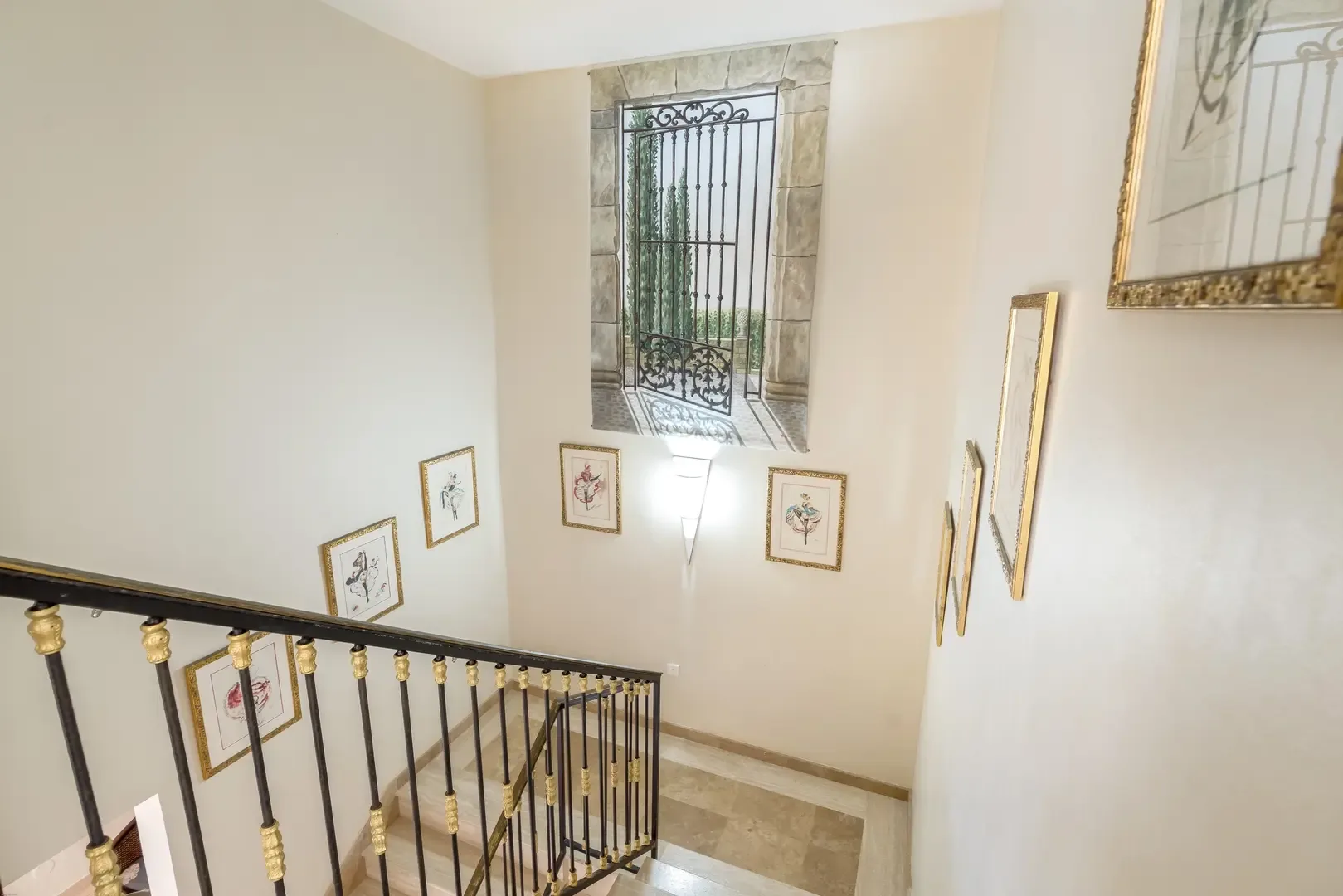 Art-lined staircase with trompe