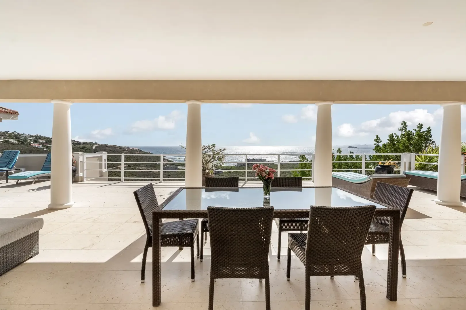 Dine al fresco under the covered terrace — ocean views accompany every meal.