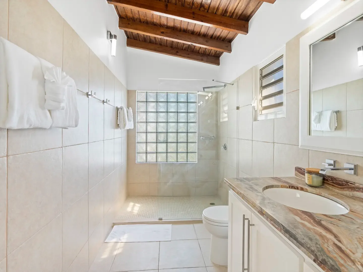 Thoughtful touches await in every bathroom — plush towels and marble finishes make daily rituals feel like a spa visit.