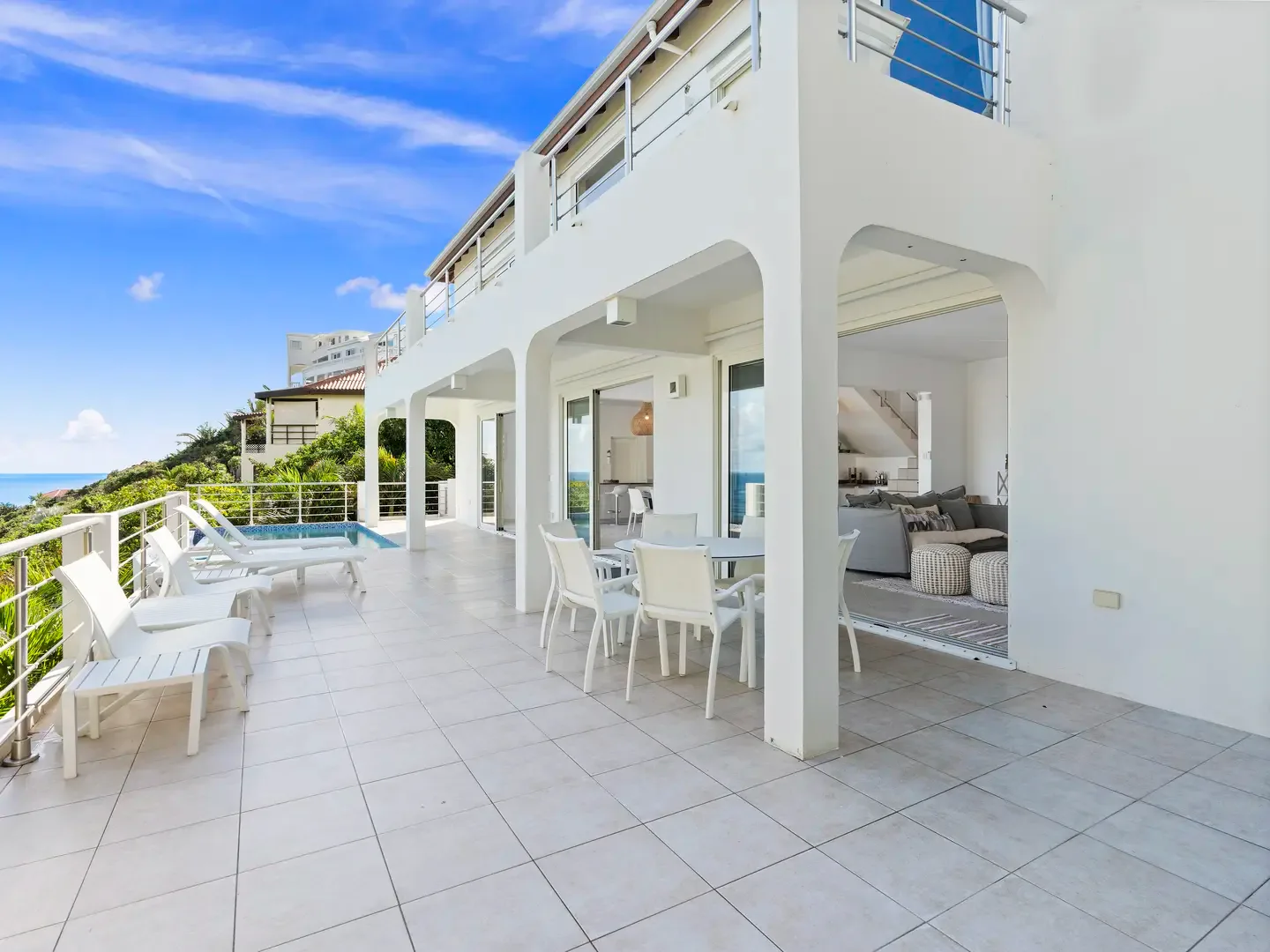 Dine al fresco on your covered terrace with uninterrupted ocean views — indoor-outdoor living at its finest.