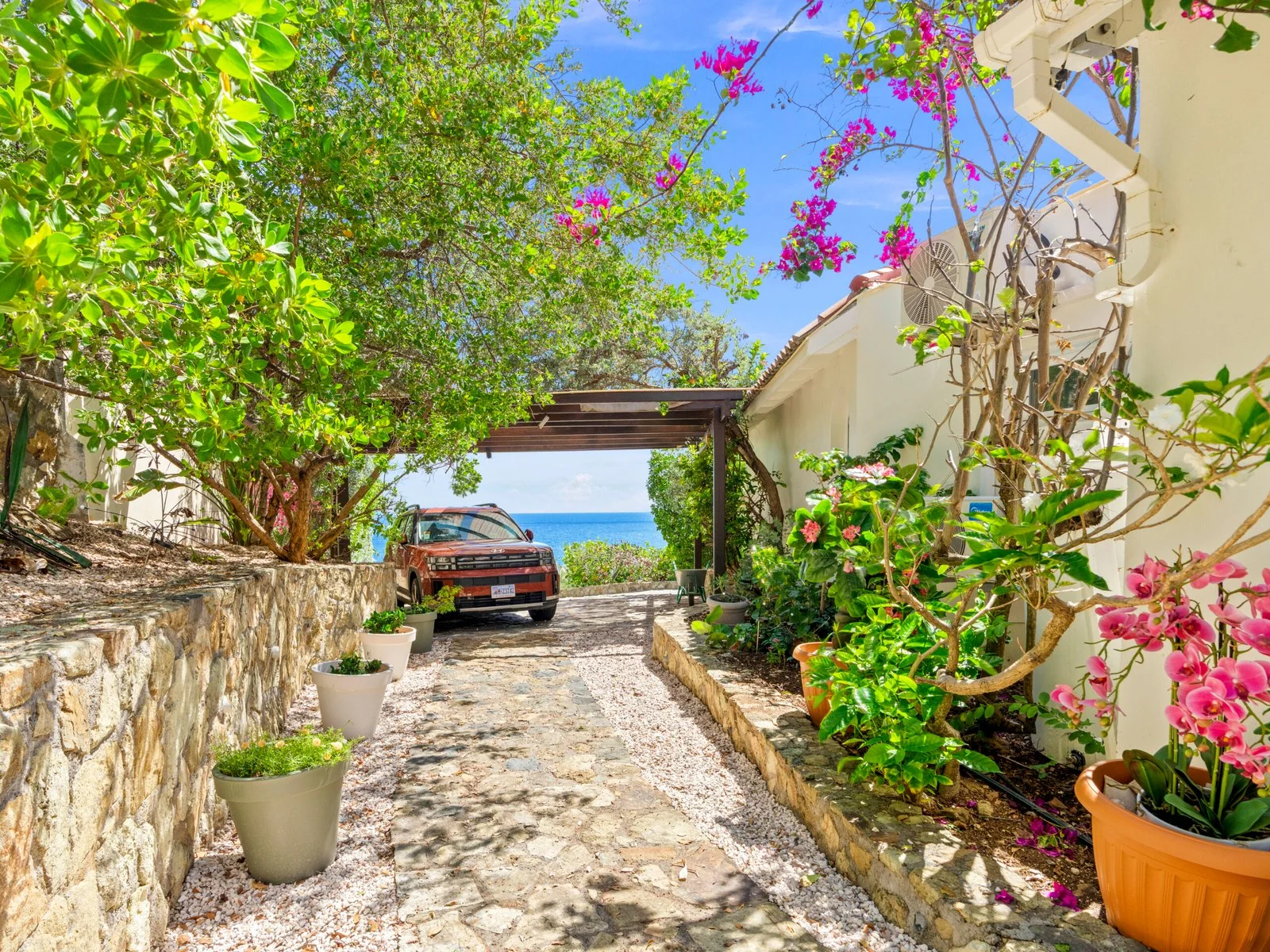 Landscaped garden path and private parking