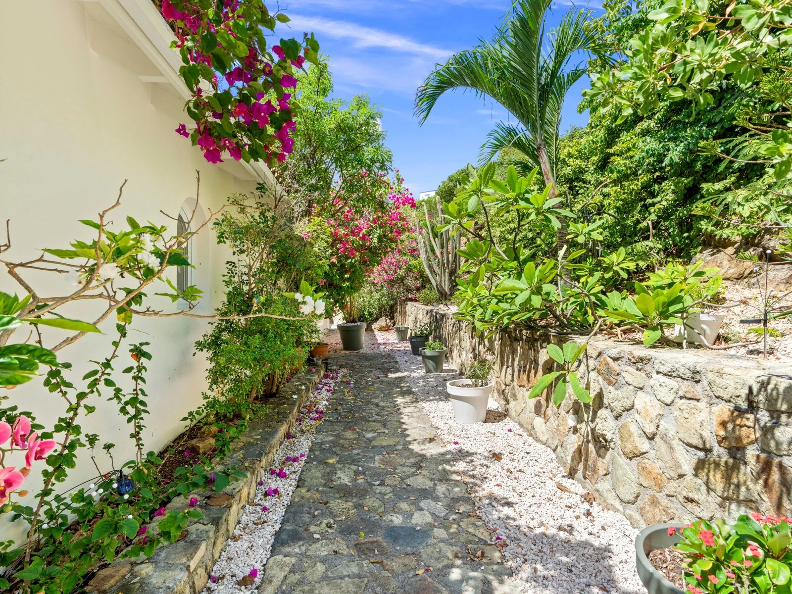 Landscaped garden path and private parking