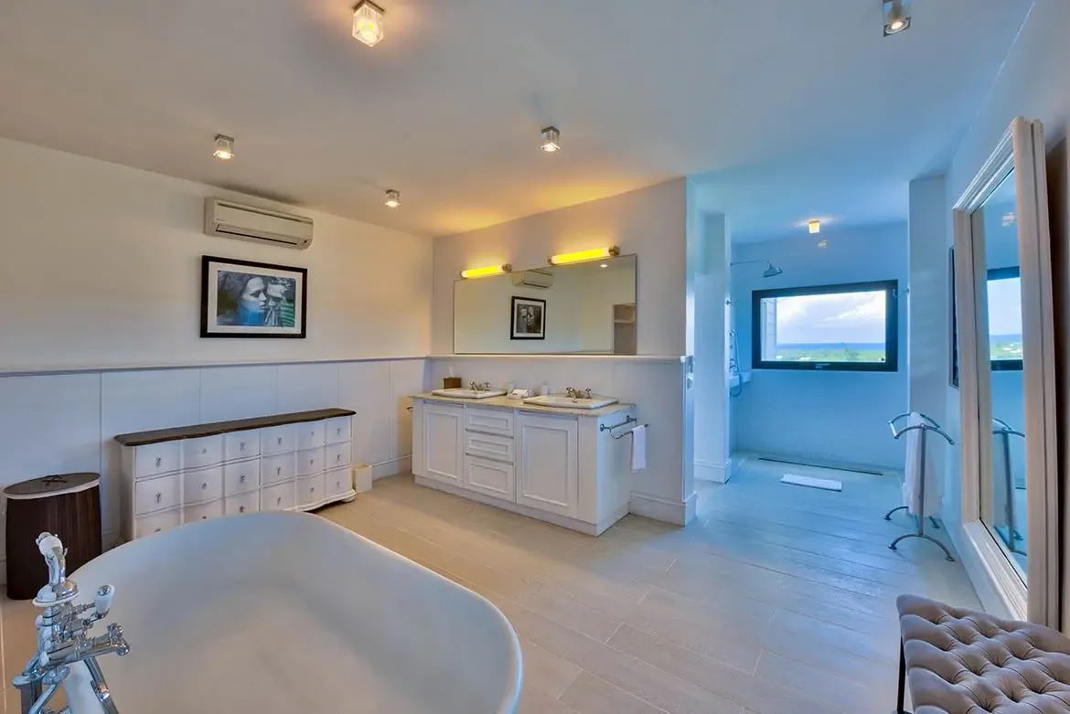Spacious walk-in shower with elegant tile work.