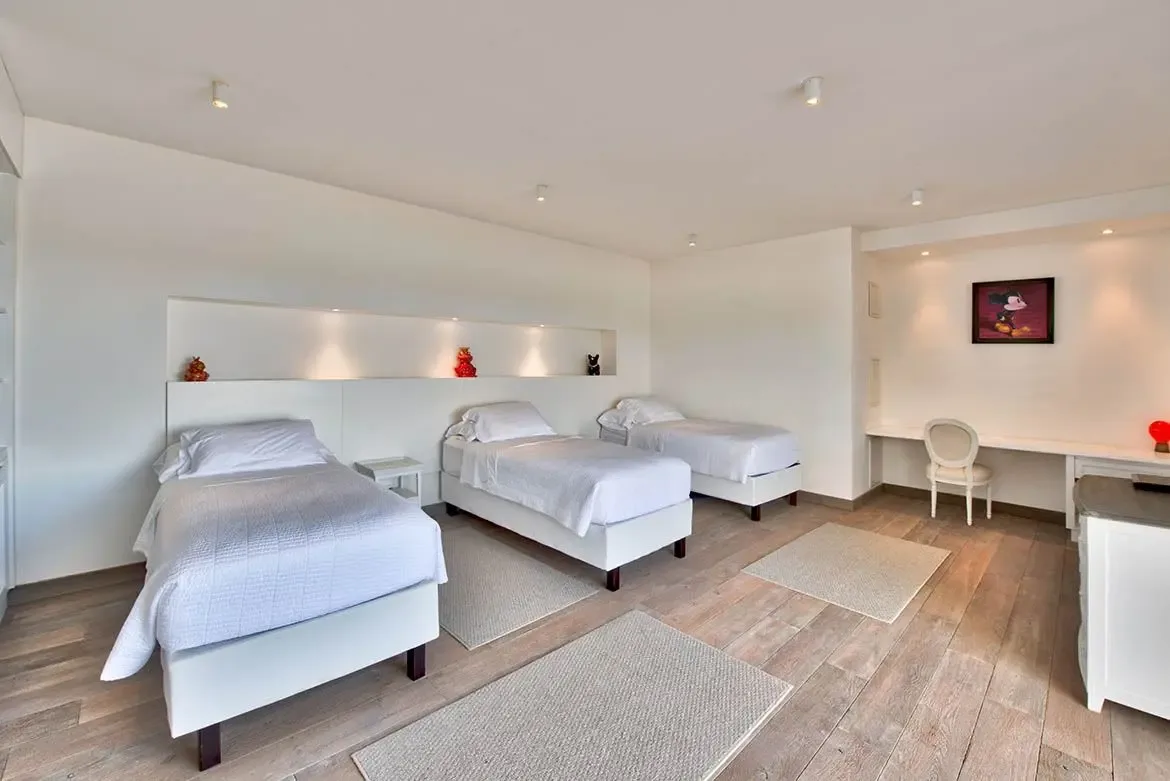Clean lines and neutral tones create a serene sleeping space.
