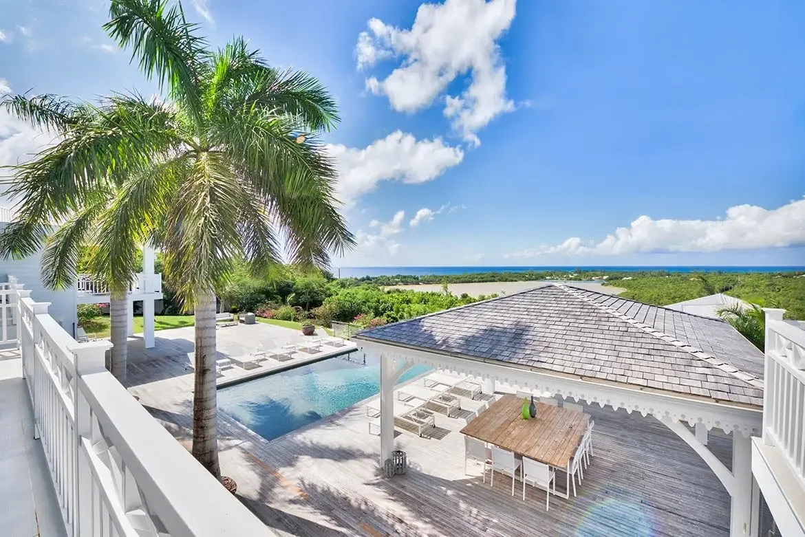 Dine al fresco by the pool with stunning ocean views — the ultimate Caribbean experience.