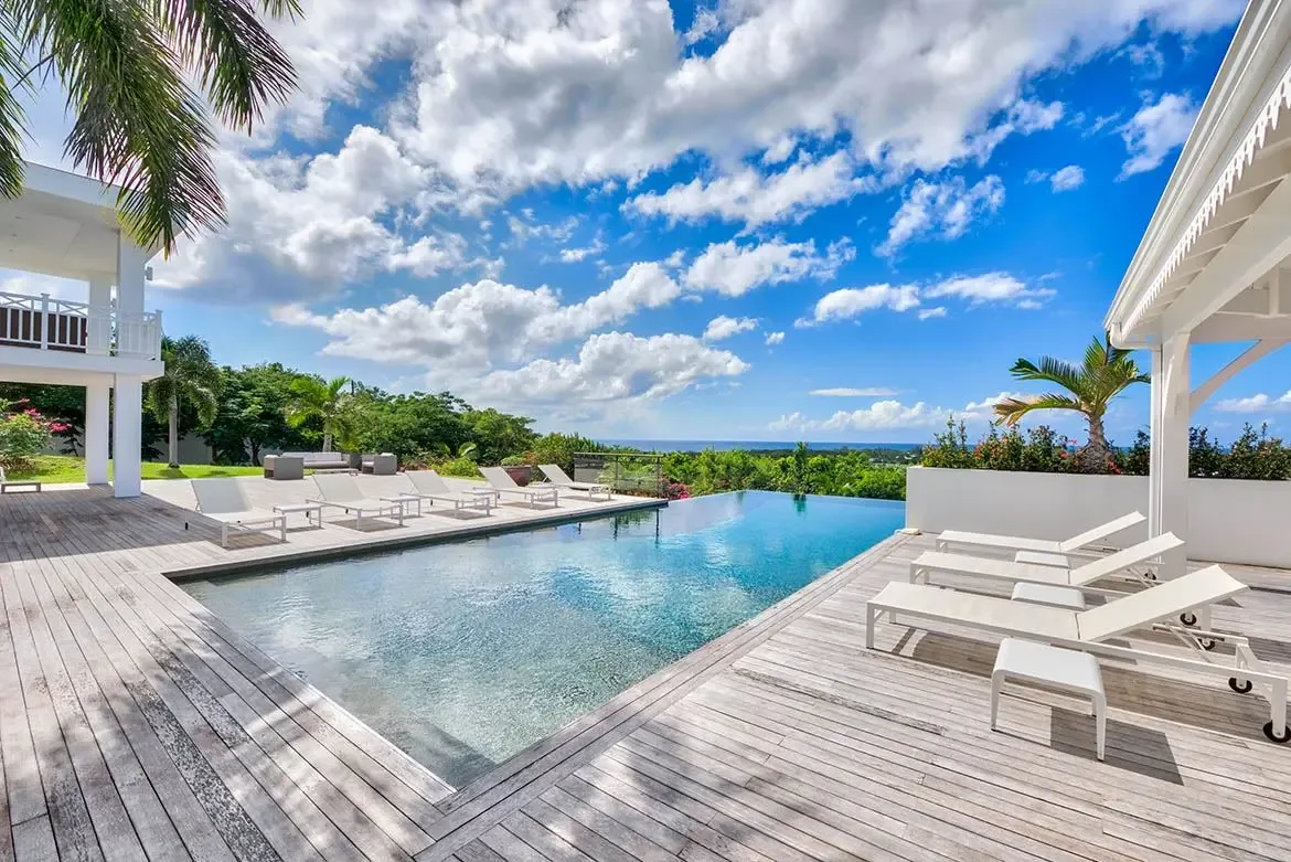 Infinity pool overlooking the Caribbean — swim to the horizon.