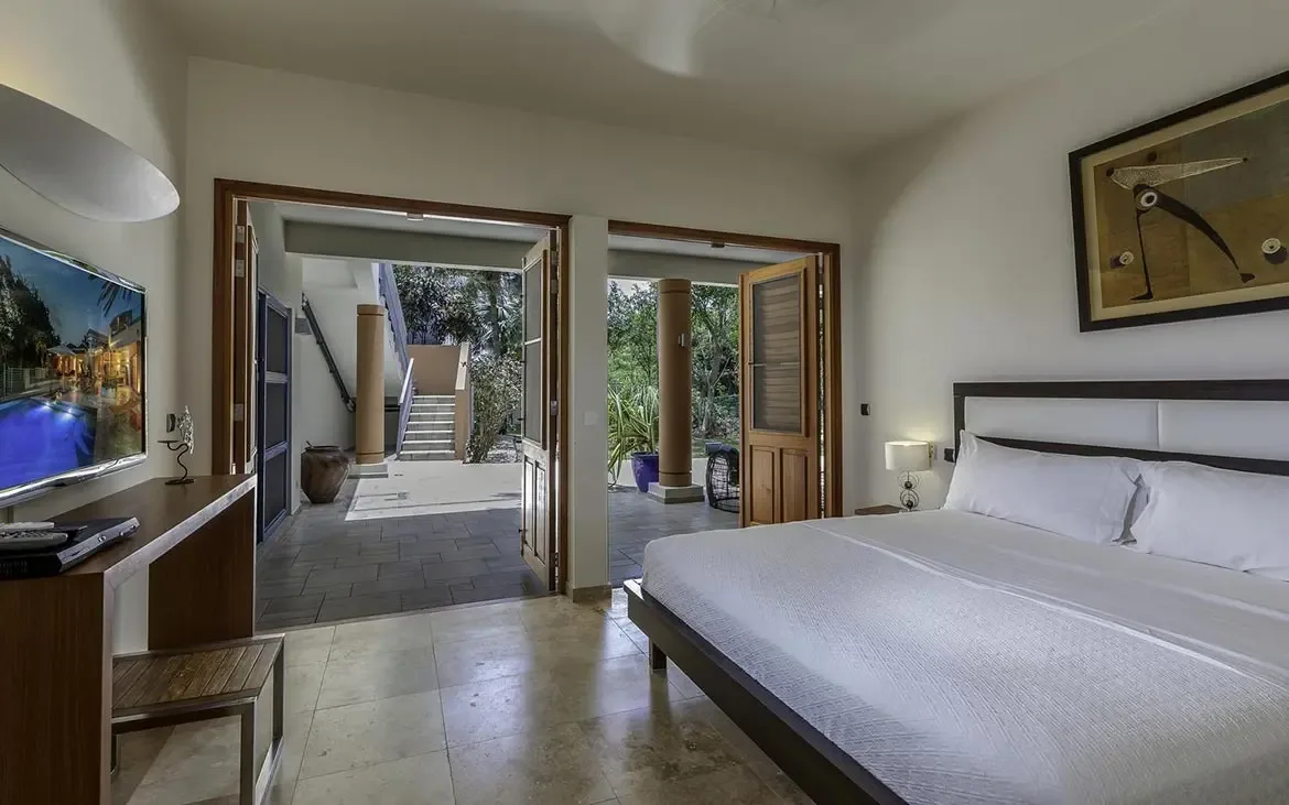 Clean lines and natural light define this comfortable guest room.