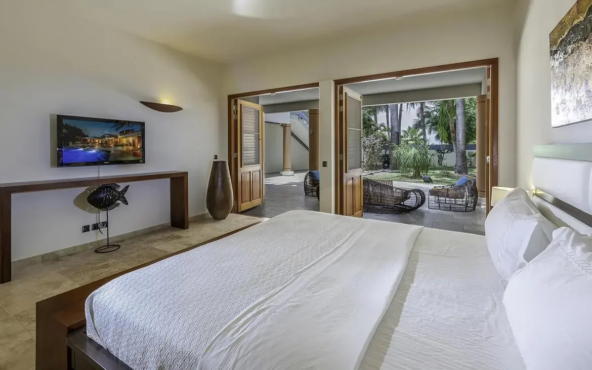 Wake up to tropical views in this elegant bedroom retreat.