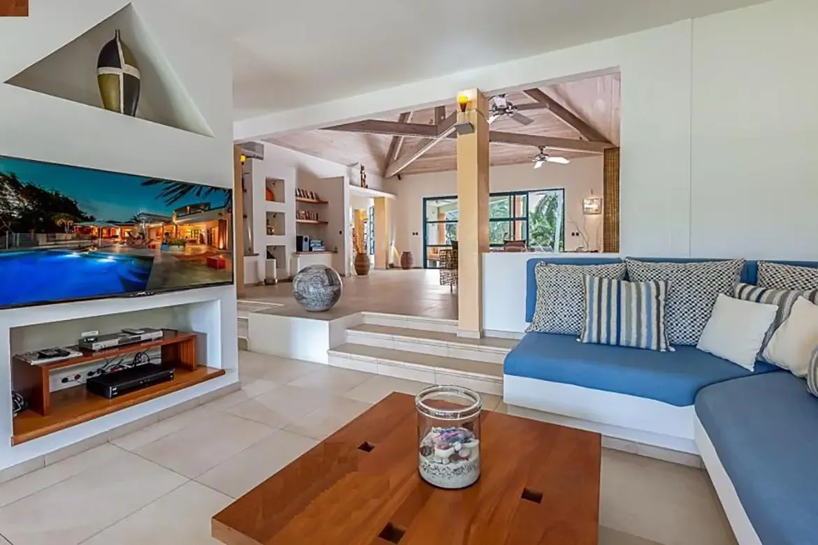 Airy living space with high vaulted ceilings and natural light.