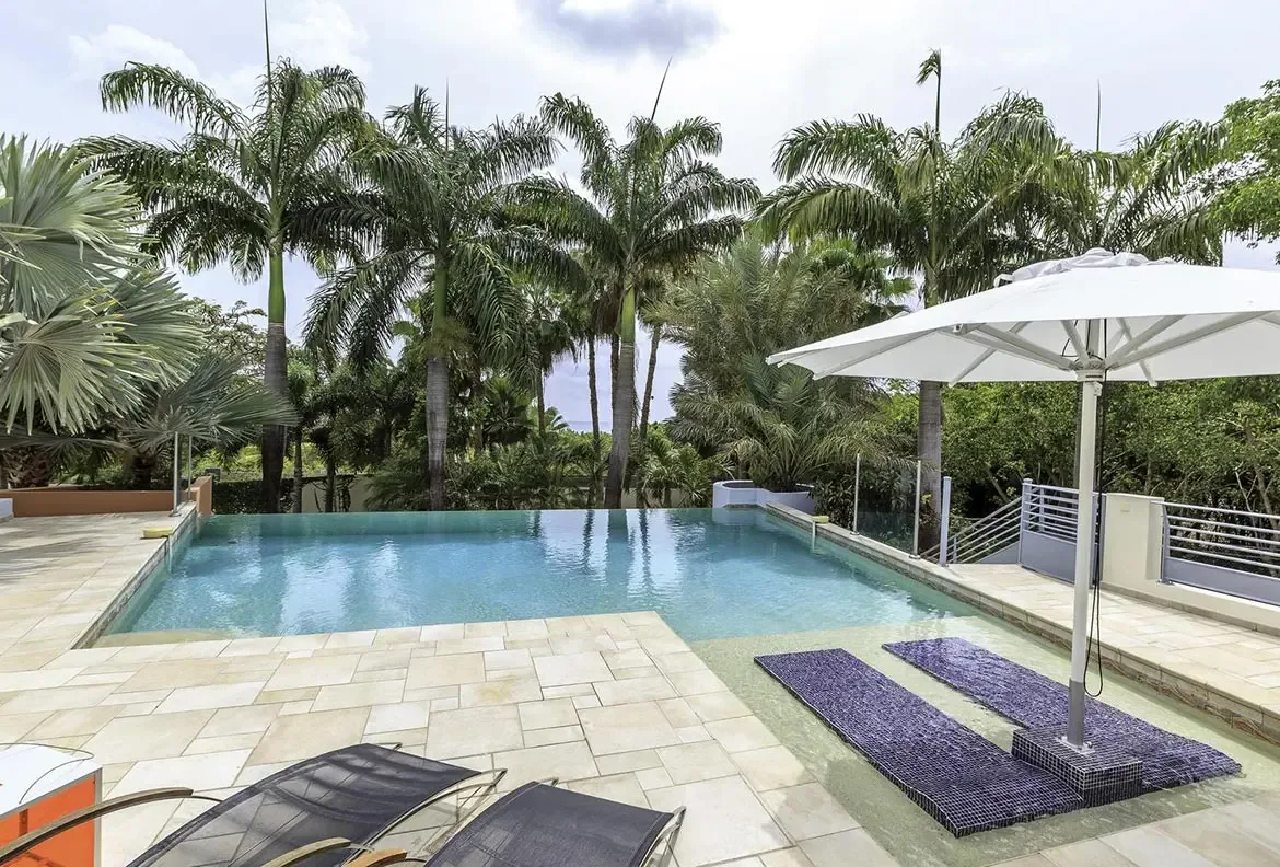 Built-in seating area in the pool for ultimate relaxation.
