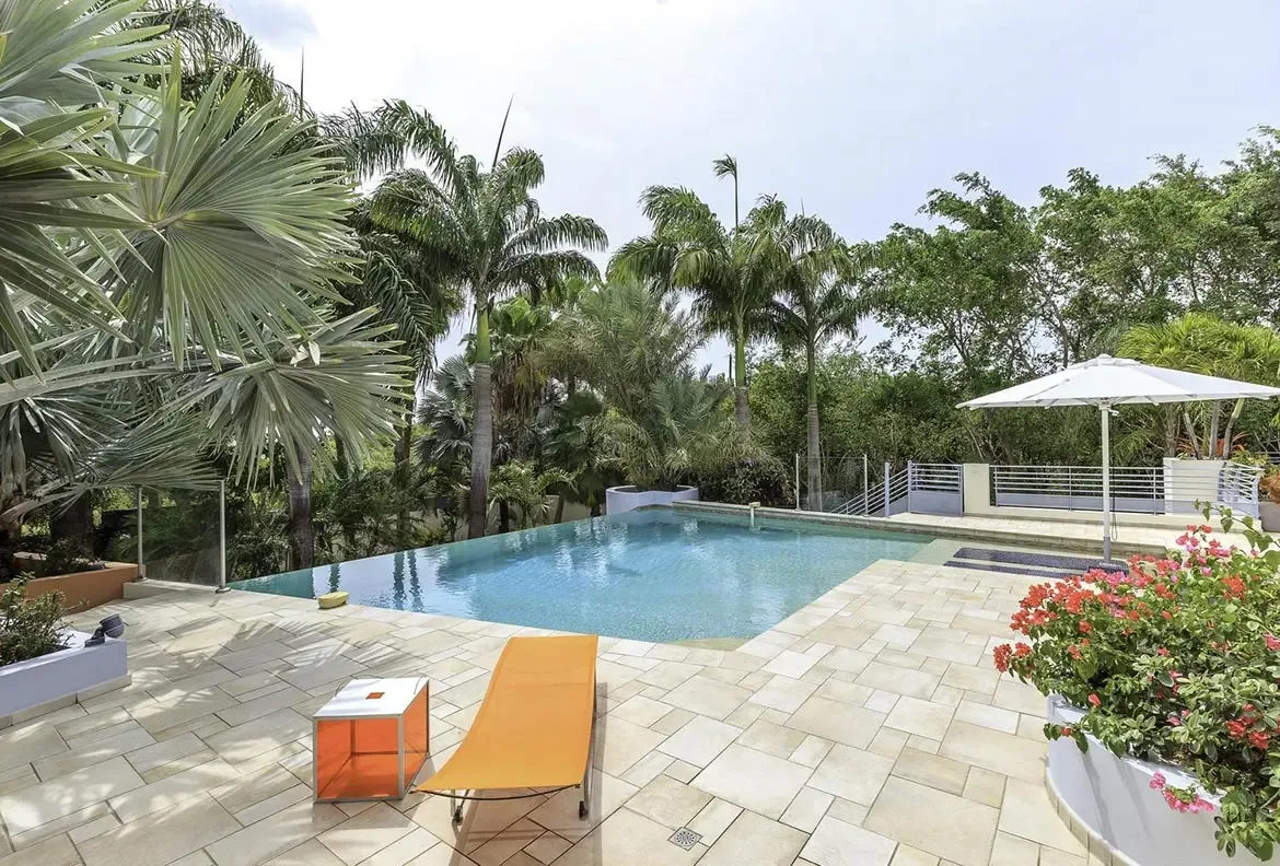 The pool at sunset — dramatic lighting transforms your outdoor oasis.