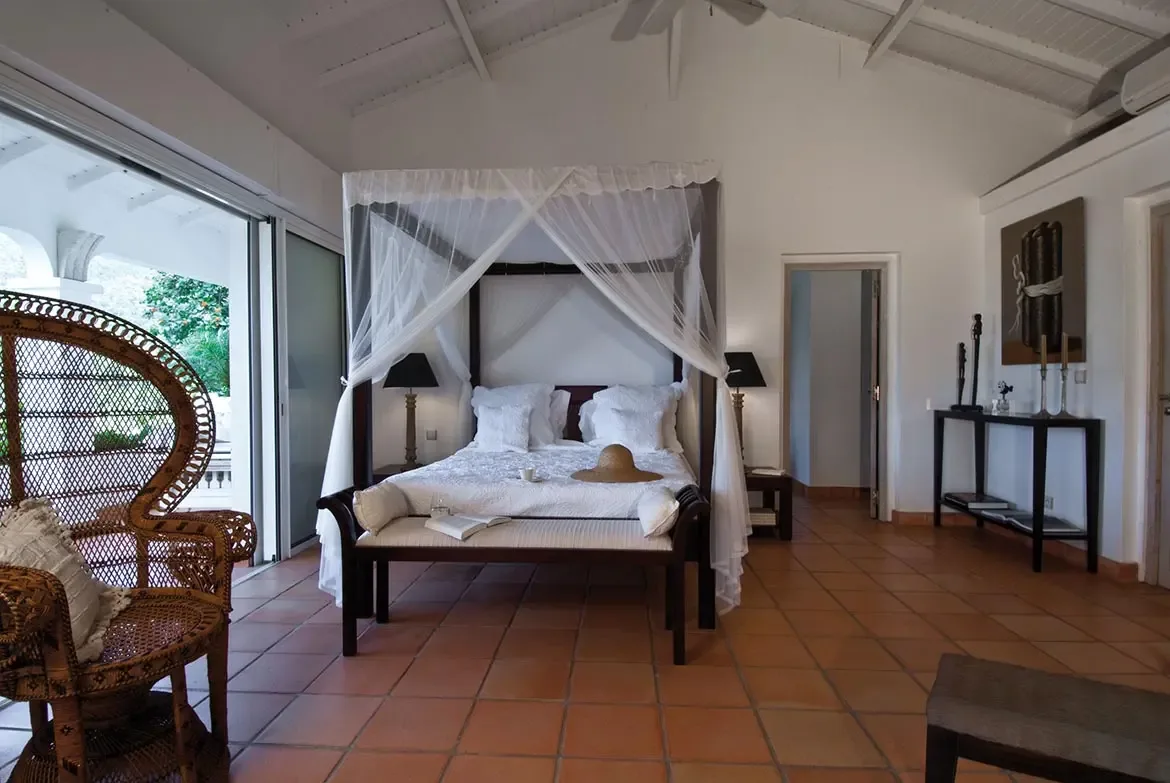 Comfortable guest bedroom with abundant natural light.