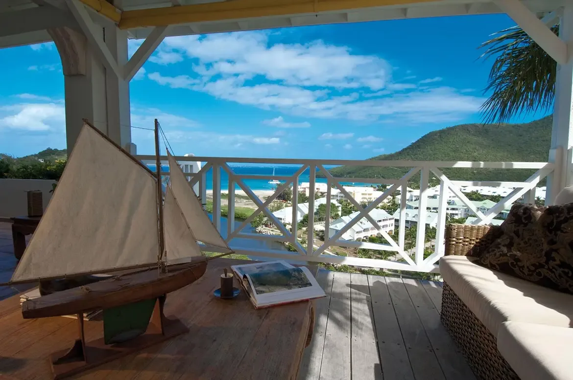 Wake up in this airy bedroom with vaulted ceilings and sliding doors to the terrace.