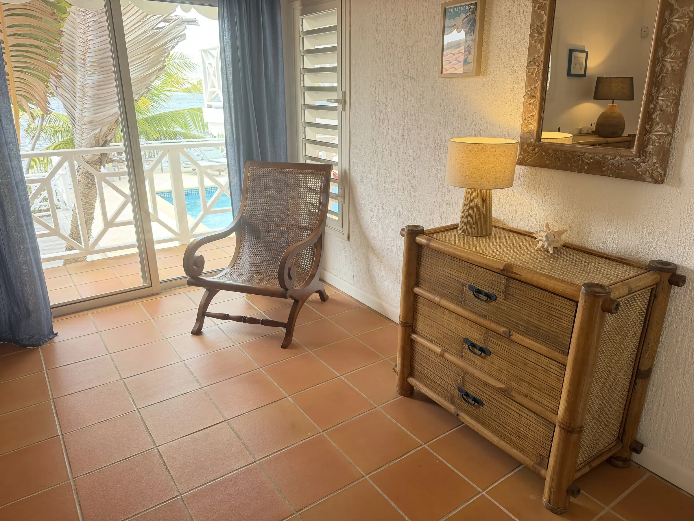 Bedroom 3 furnishings beside the doors to its private balcony.