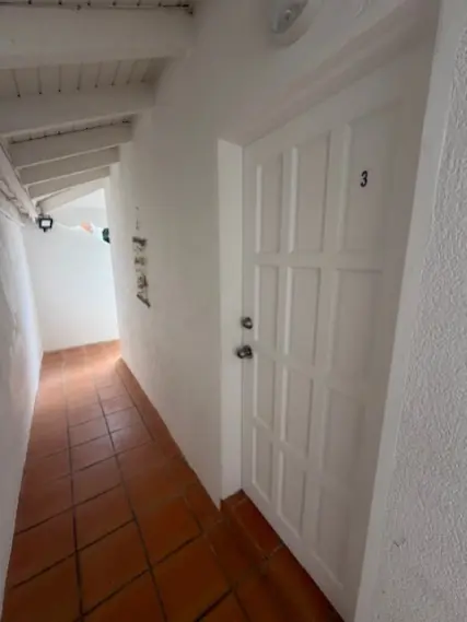 Private covered entrance leading to Bedroom 3.